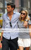 Making quite the lovely couple, Olivia Palermo enjoyed a stroll with her...